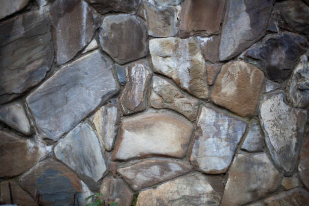 istock Natural stone texture. Cobblestone fence. 1270509889