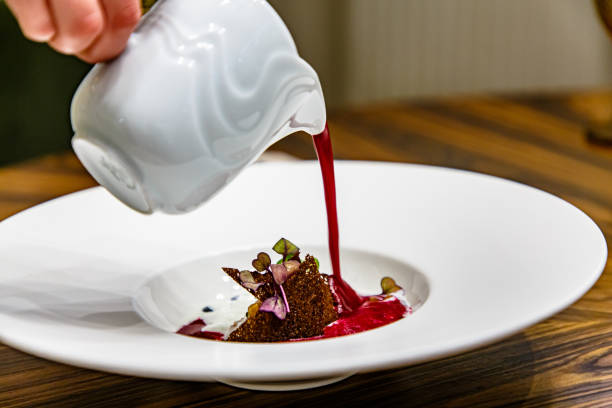 istock The waiter pours cold beetroot soup into a white plate 1270510854
