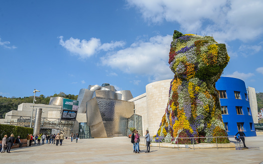 Guggenheim Museum, Bilbao, Spain, Architect Frank Gehry, 1997, Guggenheim Museum Detail Of Curving Titanium Wall.\n Guggenheim Museum Bilbao is a museum of modern and contemporary art . Built alongside the Nervion River, which runs through the city of Bilbao to the Cantabrian Sea