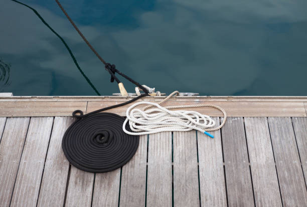 istock Coiled ropes on wooden boardwalk 1270511219
