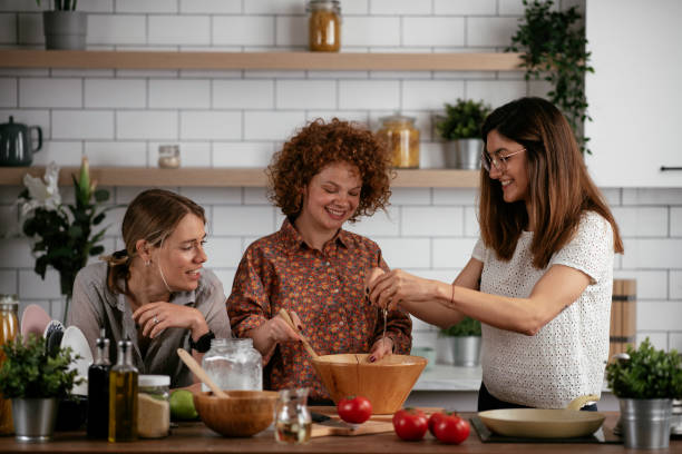 istock Sisters preparing delicious food at home. 1270512027