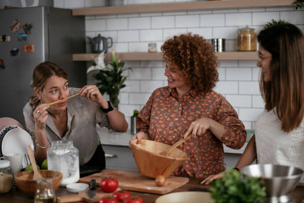 istock Sisters preparing delicious food at home. 1270517299