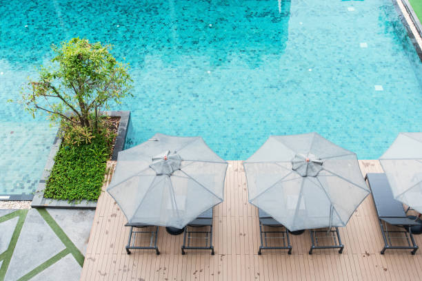 istock Resort swimming pool and sunshade topview 1270519226