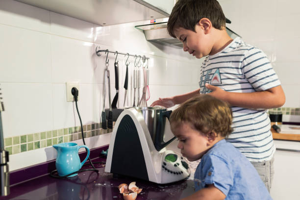 istock Two children preparing pancakes with a kitchen robot. 1270520053