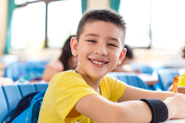 istock happy little boy studying in the classroom 1270520628