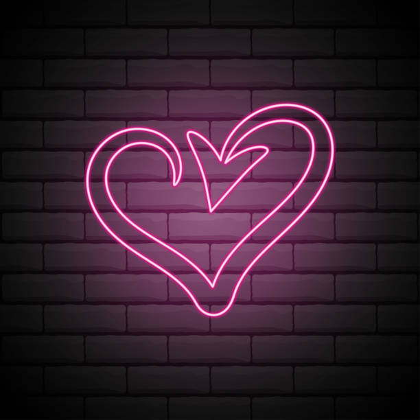 istock arrows with shape heart in neon light, valentines day vector illustration design . Isolated on brick wall 1270521734