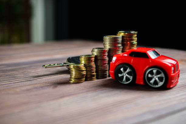 istock A car and heaps of money 1270523345