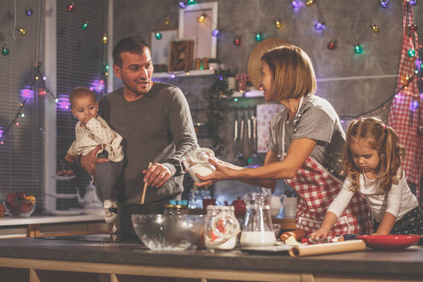istock Healthy cooperative environment in a family kitchen 1270526721