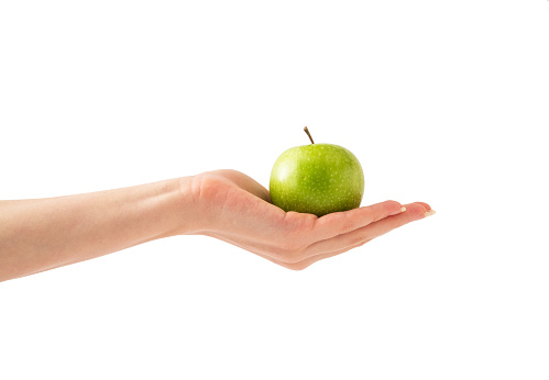 Flying green apple with apple has water drop and slice isolated on white background.
