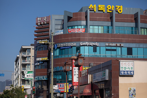 Los Angeles, California, USA  – August 3, 2020: street view of Koreatown business signs with Korean letters in LA Korea town Olympic Blvd.