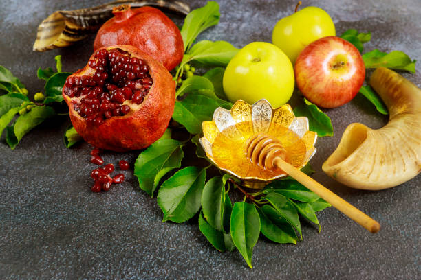 istock Pomegranate, apples and honey for Rosh Hashanah with horn. 1270539221