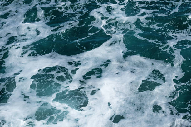 istock Abstract background of blue sea water with foam. 1270543629
