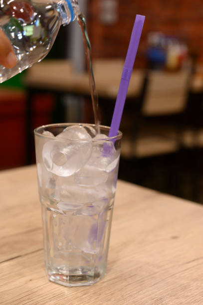 istock A glass of water on a blurred restaurant background 1270556920