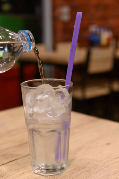 istock A glass of water on a blurred restaurant background 1270557089