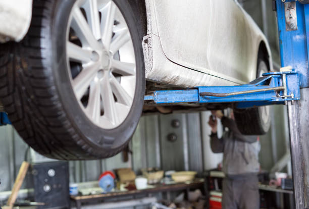 istock Auto mechanic working in garage. Repair service. 1270557697
