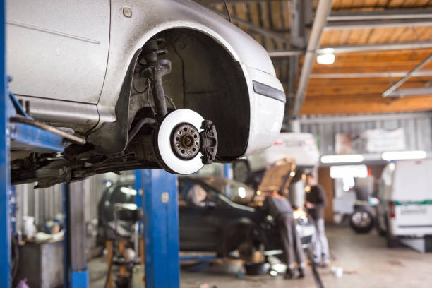 istock Auto mechanic working in garage. Repair service. 1270557745