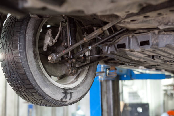 istock Auto mechanic working in garage. Repair service. 1270557757