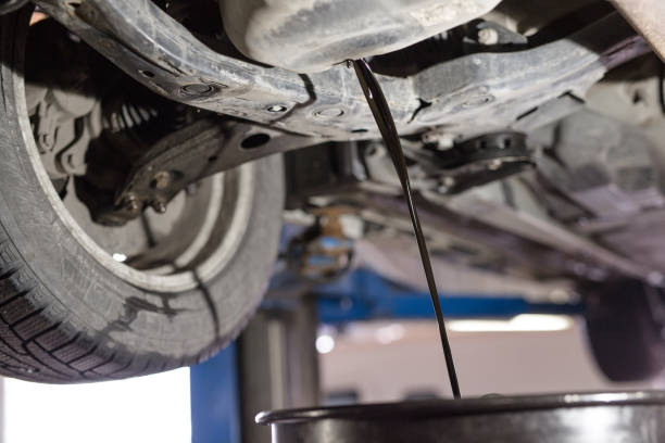 istock Change the old engine oil for car. Repair service. 1270557815