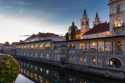 The Ljubljana Central Market in the capital of Slovenia was designed by Jože Plečnik in 1931–39. The market building stretches between the Triple Bridge and the Dragon Bridge, on the right side of the curve of the Ljubljanica River.