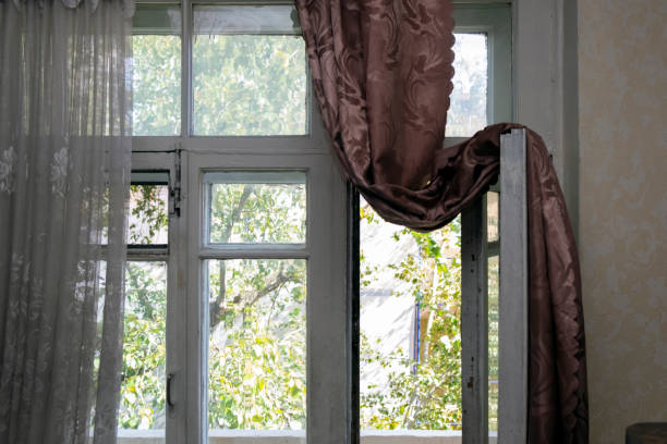 istock curtain on a balcony door 1270560422