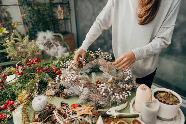 istock Young woman making a Christmas wreath 1270560640