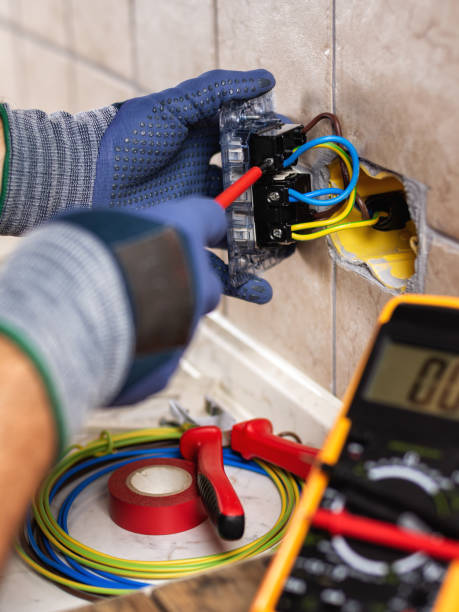 electrician at work with safety equipment on a residential electrical system. electricity. - electrical contractor imagens e fotografias de stock