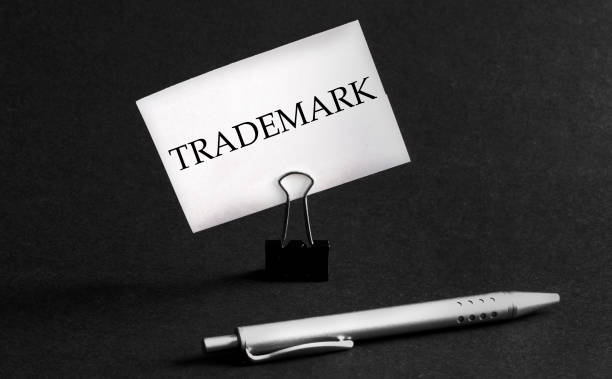 istock white paper with text Trademark on a black background with stationery 1270564629