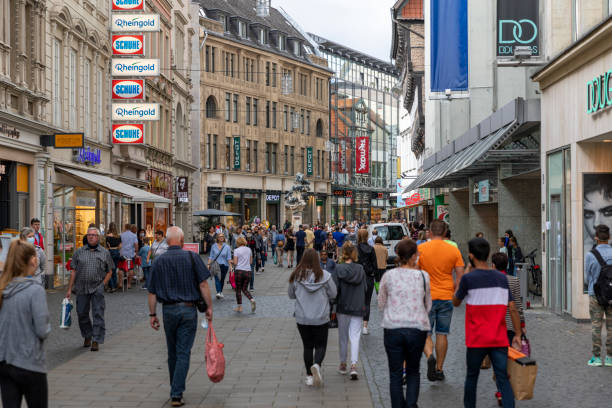 People crowding the streets of Braunschweig on last warm days of summer Braunschweig, Germany - aug 29th 2020: People are enjoying last warm days of summer in old town of Braunschweig. Many have shopping and eating out on agenda. lower saxony stock pictures, royalty-free photos & images