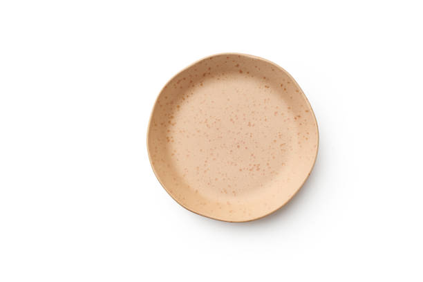 istock Top view of empty plate isolated on white background 1270566627