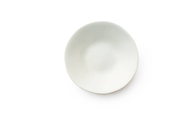 istock Top view of empty plate isolated on white background 1270566629