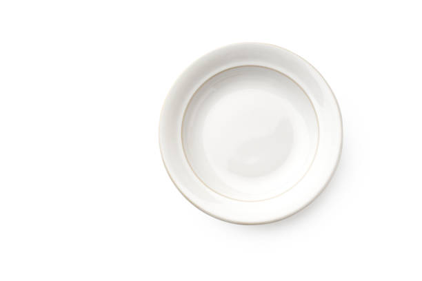 istock Top view of empty plate isolated on white background 1270566631