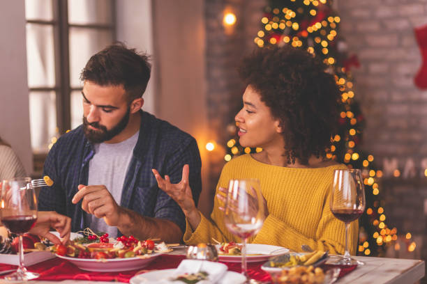 istock Couple speaking to each other at Christmas dinner 1270566657