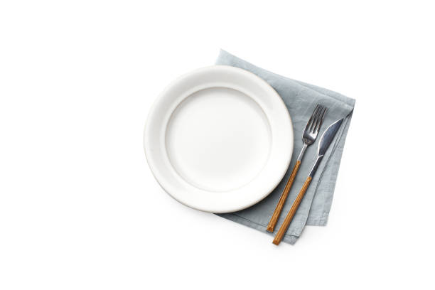 istock Top view of empty plate isolated on white background 1270566752