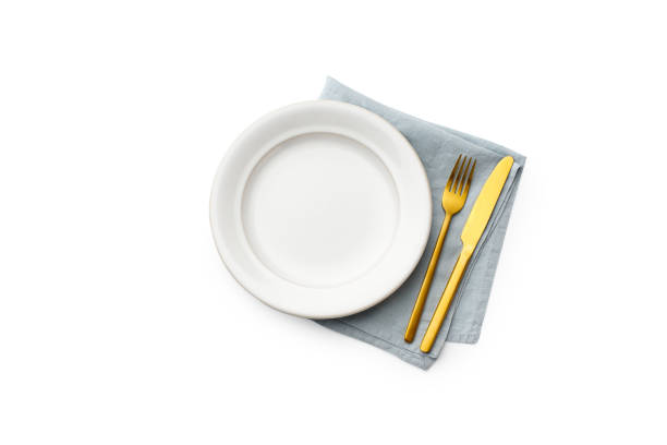 istock Top view of empty plate isolated on white background 1270566754