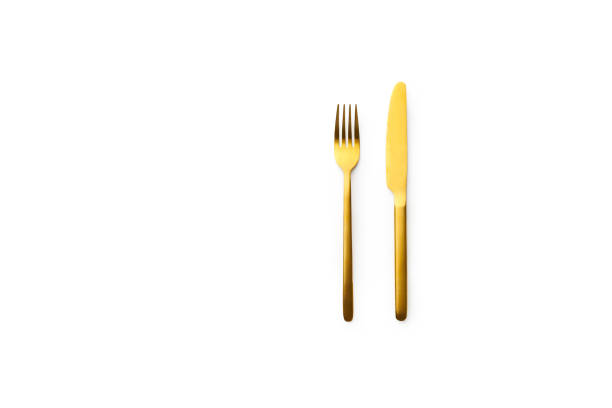 istock Top view with golden cutlery isolated on white background 1270566757