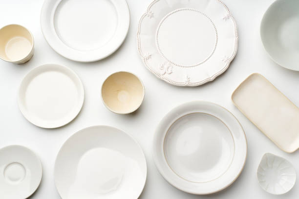 istock Top view of empty plates on white background 1270566787