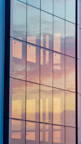 istock Fiery Morning Sky Seen Through A Glass Building 1270566904