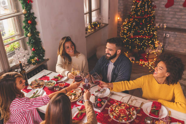 istock Friends making a toast at Christmas dinner 1270567002