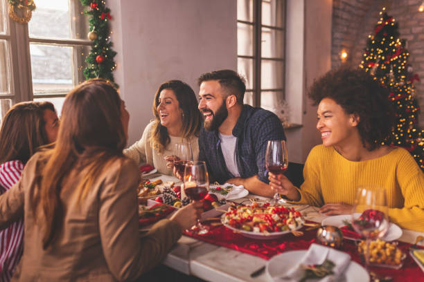 istock Friends celebrating Christmas over dinner 1270567732
