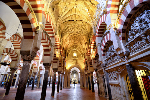 Moorish style arches in interior of the Mosque Cathedral of Cardoba, Spain