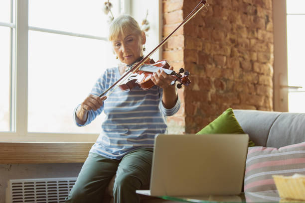 istock Senior woman studying at home, getting online courses 1270570830