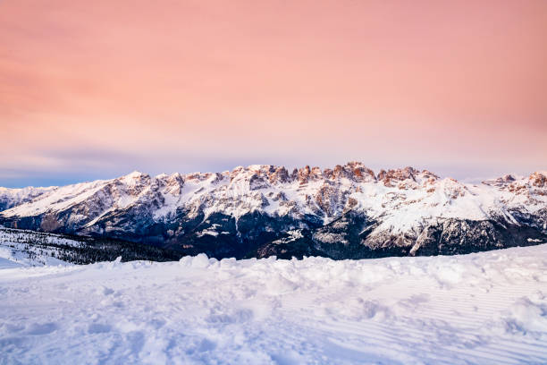 View of the snow capped Italian Alps of the Brenta Dolomites in a late afternoon at sunset