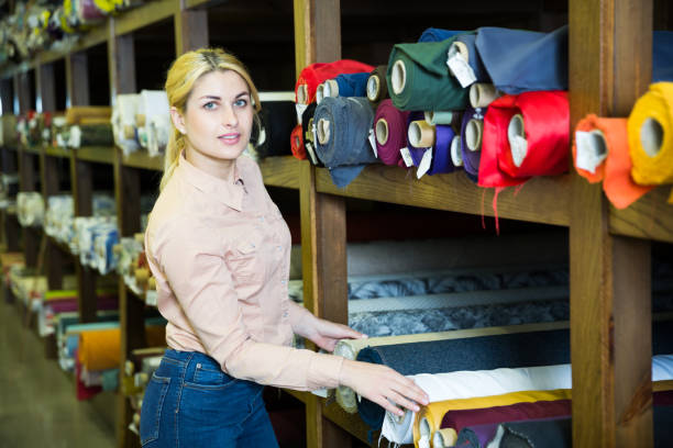 istock Woman choosing textiles in shop 1270571124