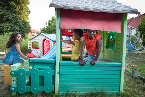 istock Children have fun in a playhouse in back yard 1270571154