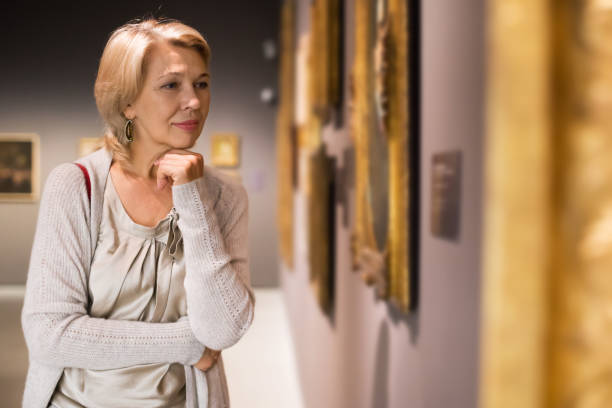istock Woman looking at picture collection 1270572069