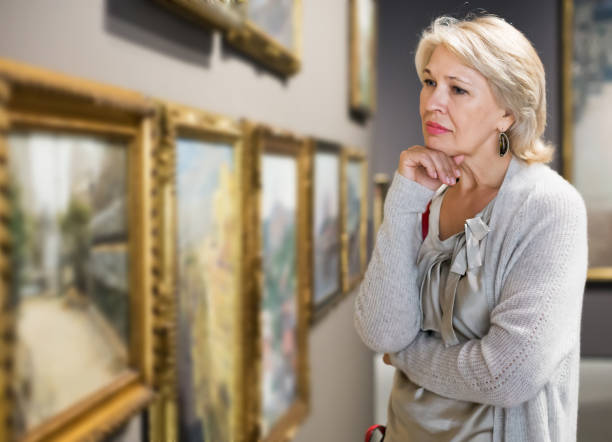 istock Woman looking at picture collection 1270572071