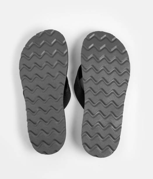 istock Pair of black rubber sole flip-flops isolated on white background 1270573610