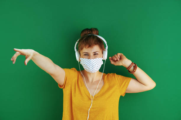 istock cheerful learner woman dancing and listening to music 1270577163
