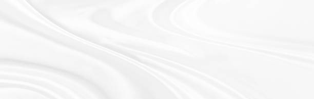 istock White gray satin texture that is white silver fabric silk panoramic background with beautiful soft blur pattern natural. 1270578840