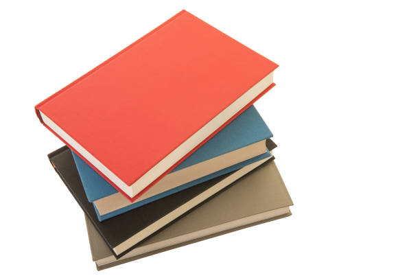 istock Staple of four books seen from an high angle view isolated on a white background 1270582448